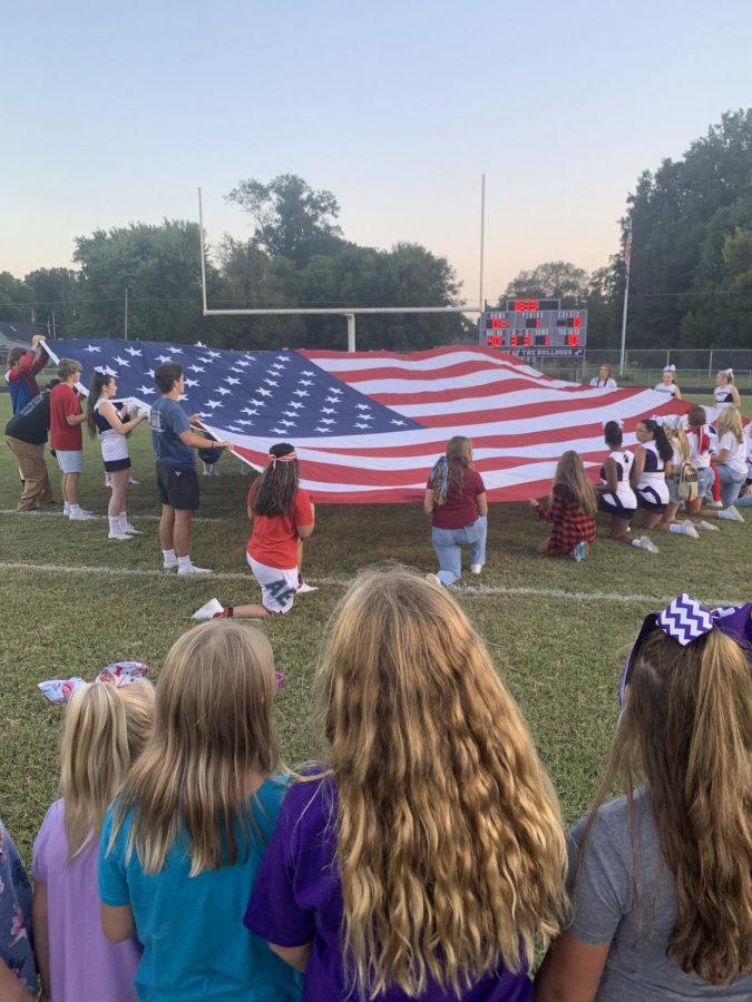 Pep Club donned their red, white and blue and took the field during a ceremony to help honor the 13 soldiers who died during the evacuation of Kabul, Afghanistan.
