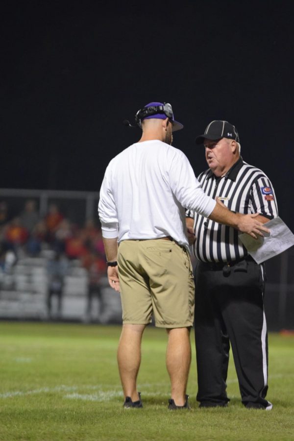 Head Coach Matt Griffith discusses a call with the referee.