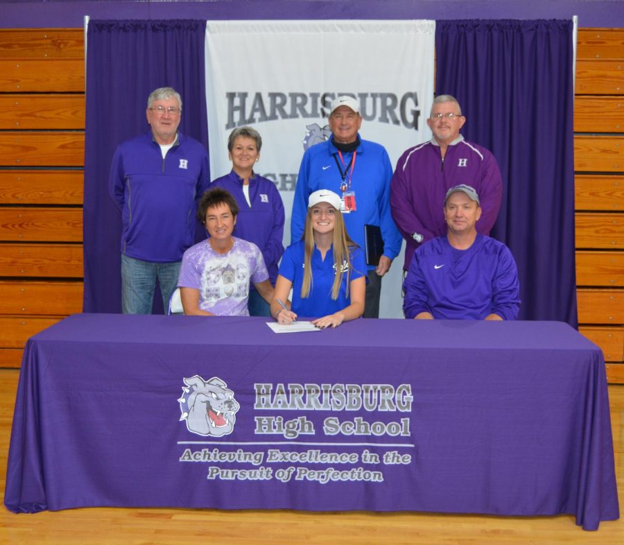 Senior Madison McClusky signs her letter of intent to play golf for John A. Logan College in Carterville next fall. McClusky is pictured with her parents Lori and Eric, her grandparents Steve and Cindy Black, who also coach the golf team, her JAL coach, Mike Bush, and athletic director Greg Langley.