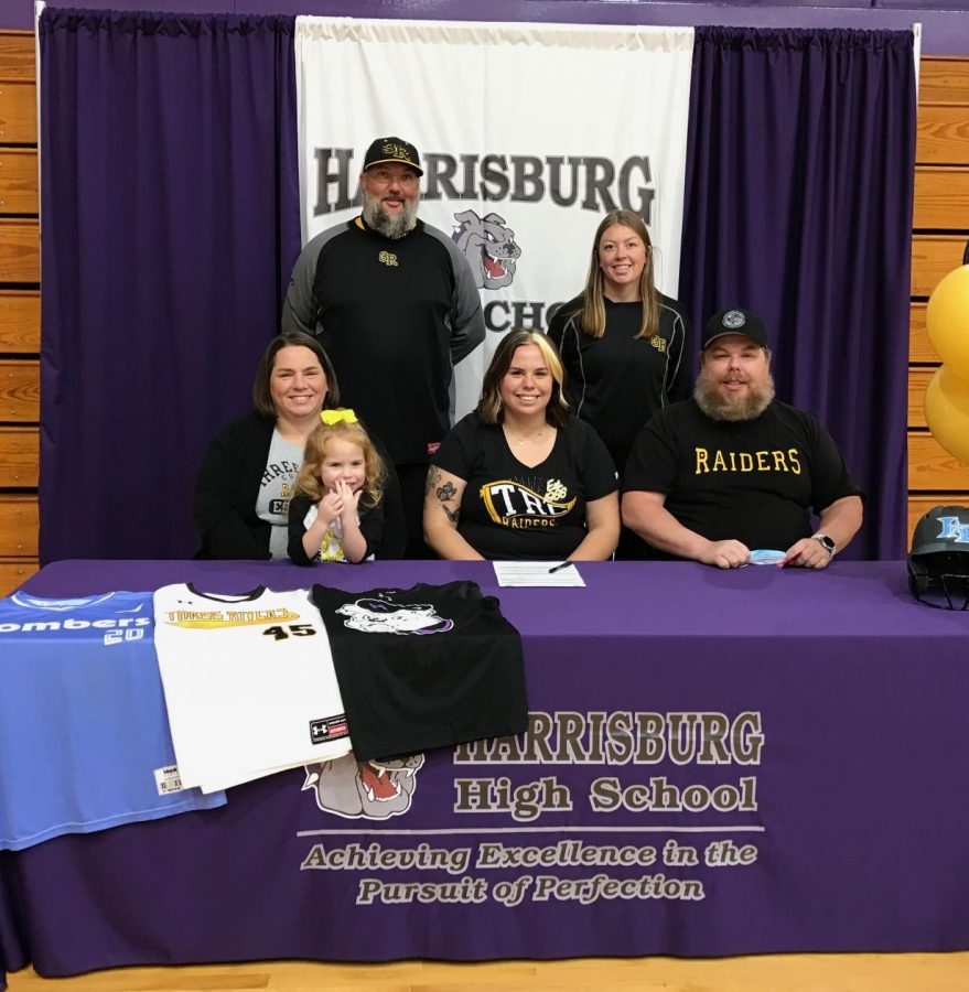 Senior Kerrigan Payne signs for softball with Three Rivers College. Pictured with Payne are her mother, Carrie, and sister, Karsyn, and her father, Keith.  Standing are Jeff Null, head coach at Three Rivers College, and assistant c Summer Shackley.