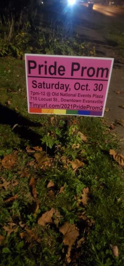 A Pride Prom sign is displayed in a supporters front yard.