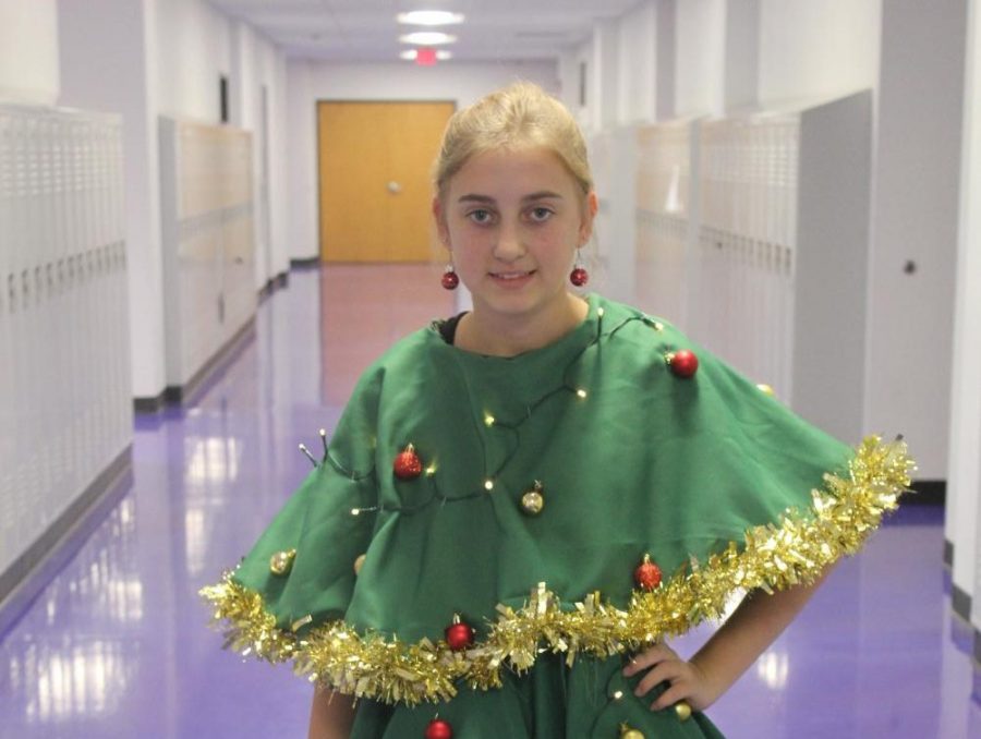Freshman+Emma+Bolin+shows+off+her+winning+costume+during+Christmas+Spirit+Week+2019.+Bolin+is+now+a+junior.