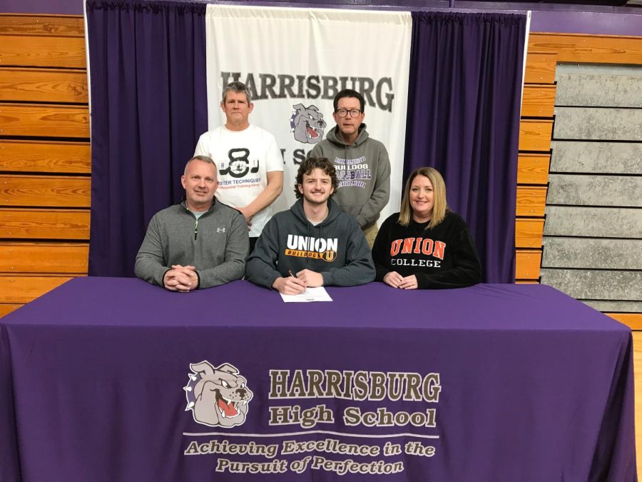 Senior, Drew Hawkins, signing to Union with his parents and coaches by his side.