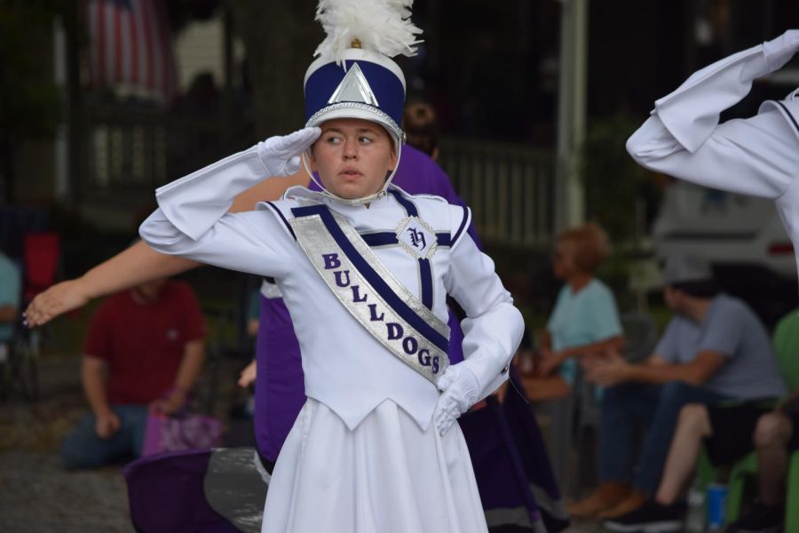 Drum major Ali Hankins salutes during the bands performance at Popcorn Days. 