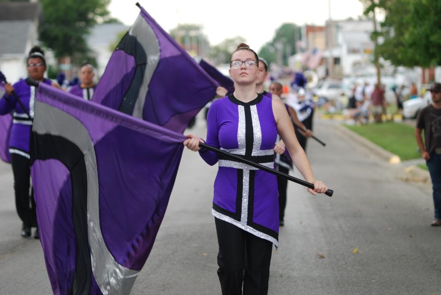 Senior Katelynn Hall prepares to throw her flag during the bands routine at Popcorn Days.
