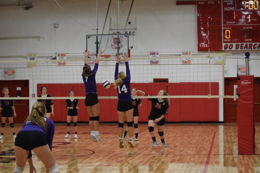Sophomores Taylor Michel and Gabby Shires block the ball winning the Ladydogs a point Sept. 14