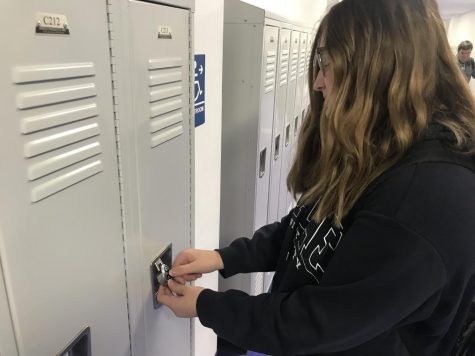 Freshman Kylee Bridewell goes to her locker before class starts. Freshmen were the first group to be assigned a locker.
