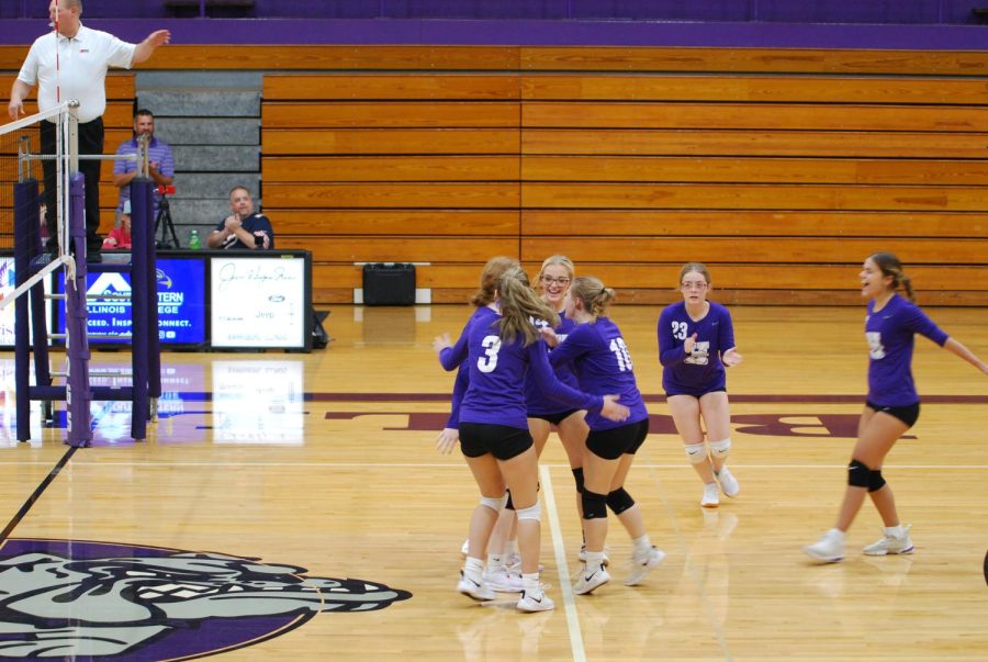 Sophomores Gabby Shires, Kaylee King, Taylor Michel and Emma Miles celebrate with juniors Layla Borders and Maysa Moore in the game against Benton  Sept 8.