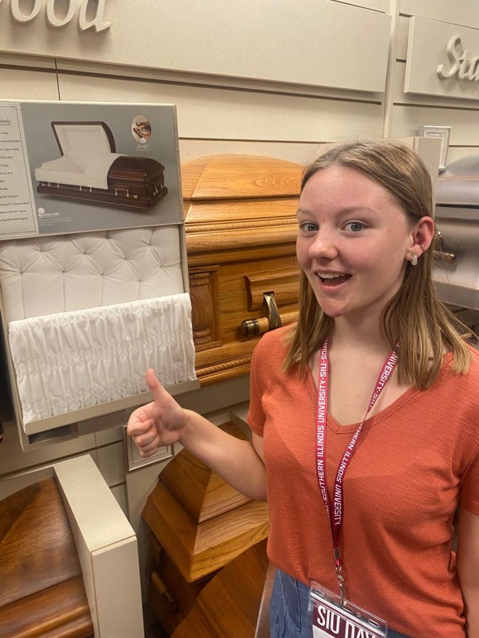 Junior Maysa Moore looks at a casket display during SIUC Career Day. Moore plans to major in nursing. 