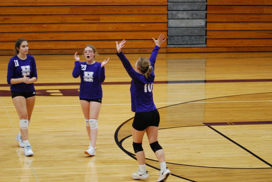 Sophomore Olivia Fehrenbacher and juniors Maysa Moore and Layla Borders celebrate a point against the Benton Rangerettes Sept. 8.