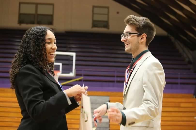 Sophomore Jocelyn Dismuke stands with senior Grant Dooley at speech competition