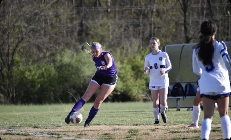 Myers goes for the goal against her opponent.