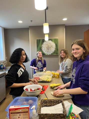 White Hats members work in groups to prepare the meal for families staying in the Ronald McDonald House of Charities.