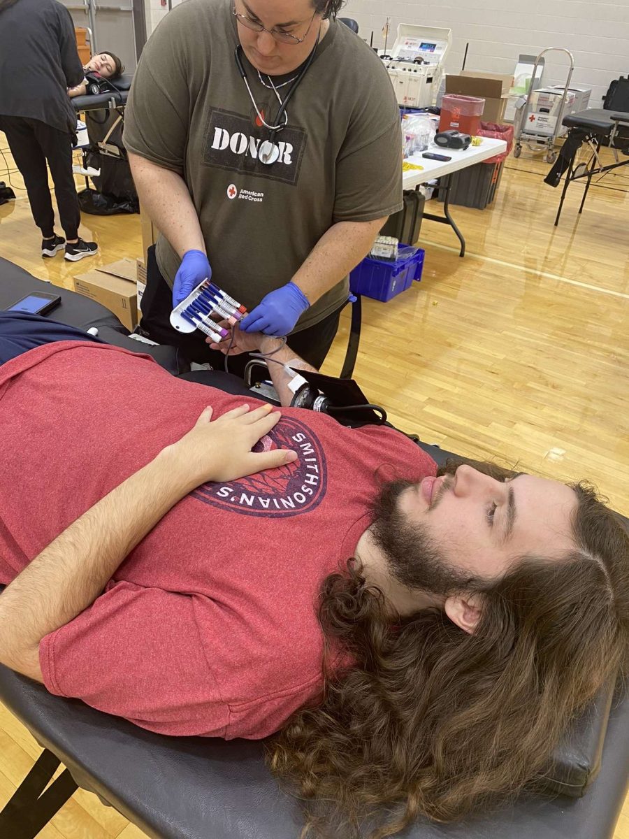 Senior Wilson DeNeal relaxes during his blood donation.
