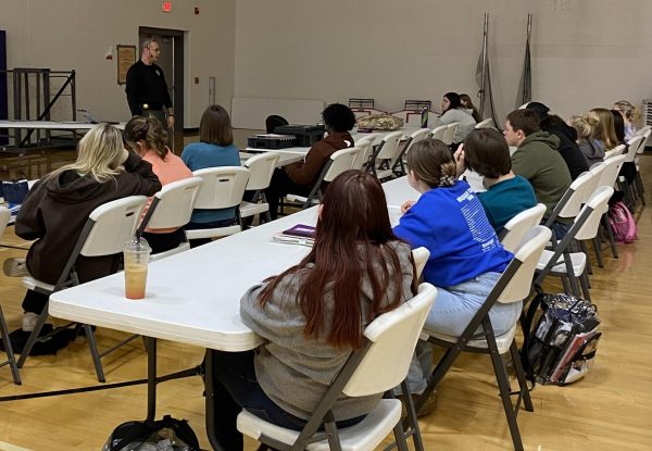 Sergeant Jason Craddock talking to the students about crime scene investigation. The students who attended Sergeant Craddocks CSI workshop ranges from all ages freshman through senior.