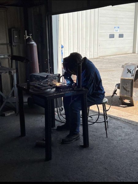 Senior Max Maynor welds in his SIC welding shop class.