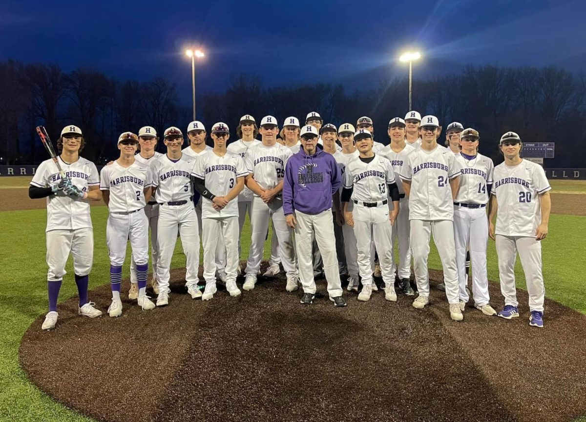 The HHS baseball team posed with coach Jay Thompson before their game.
