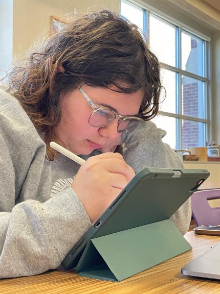 Senior Francesca Messerschmidt works on an editorial cartoon for the IHSA Sectional meet April 6. Students were given a prompt that required them to take a position, pro or con, and create a cartoon to reflect the position. Messerschmidt worked on her iPad using a program called Procreate. Results will be posted April 12 on the IHSA website. 