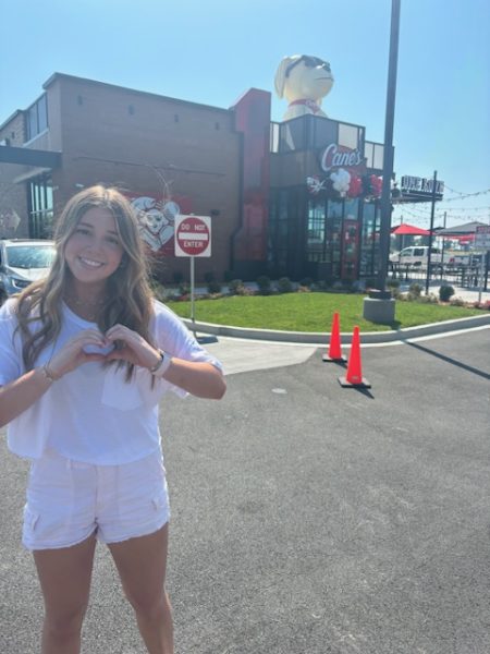 Junior Quincy Nicholes visits Raising Cane's on their opening day.