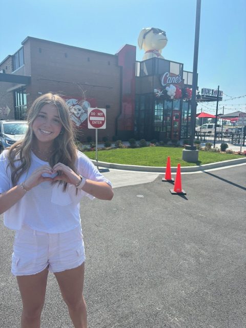 Junior Quincy Nicholes visits Raising Cane's on their opening day.