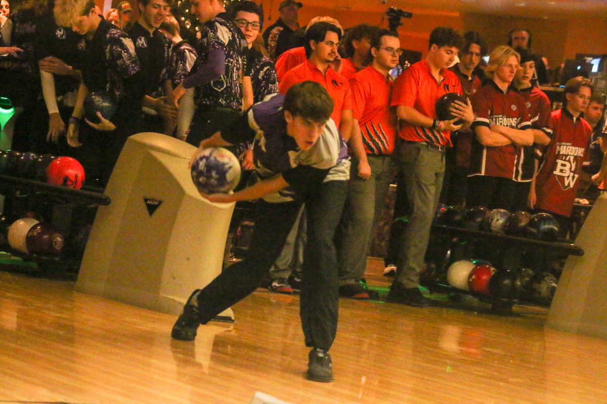 Senior bowling member Jonathon Carlton takes the ball down the lane during the Harrisburg Invitational. The team heads to state this weekend in hopes for a first place finish.