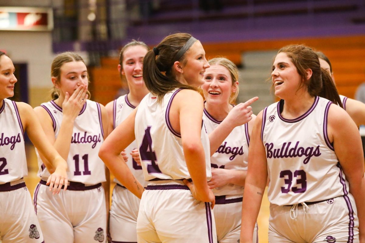 Teammates celebrate with Jamison Green after she broke the school record. Although the season didn't end exactly as the hoped, it is one to remember.